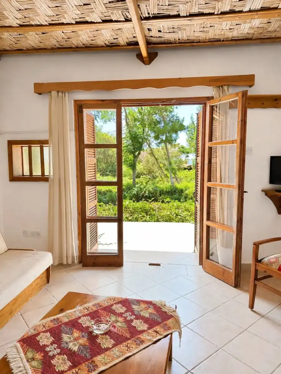 Poolside Bungalow living room facing garden